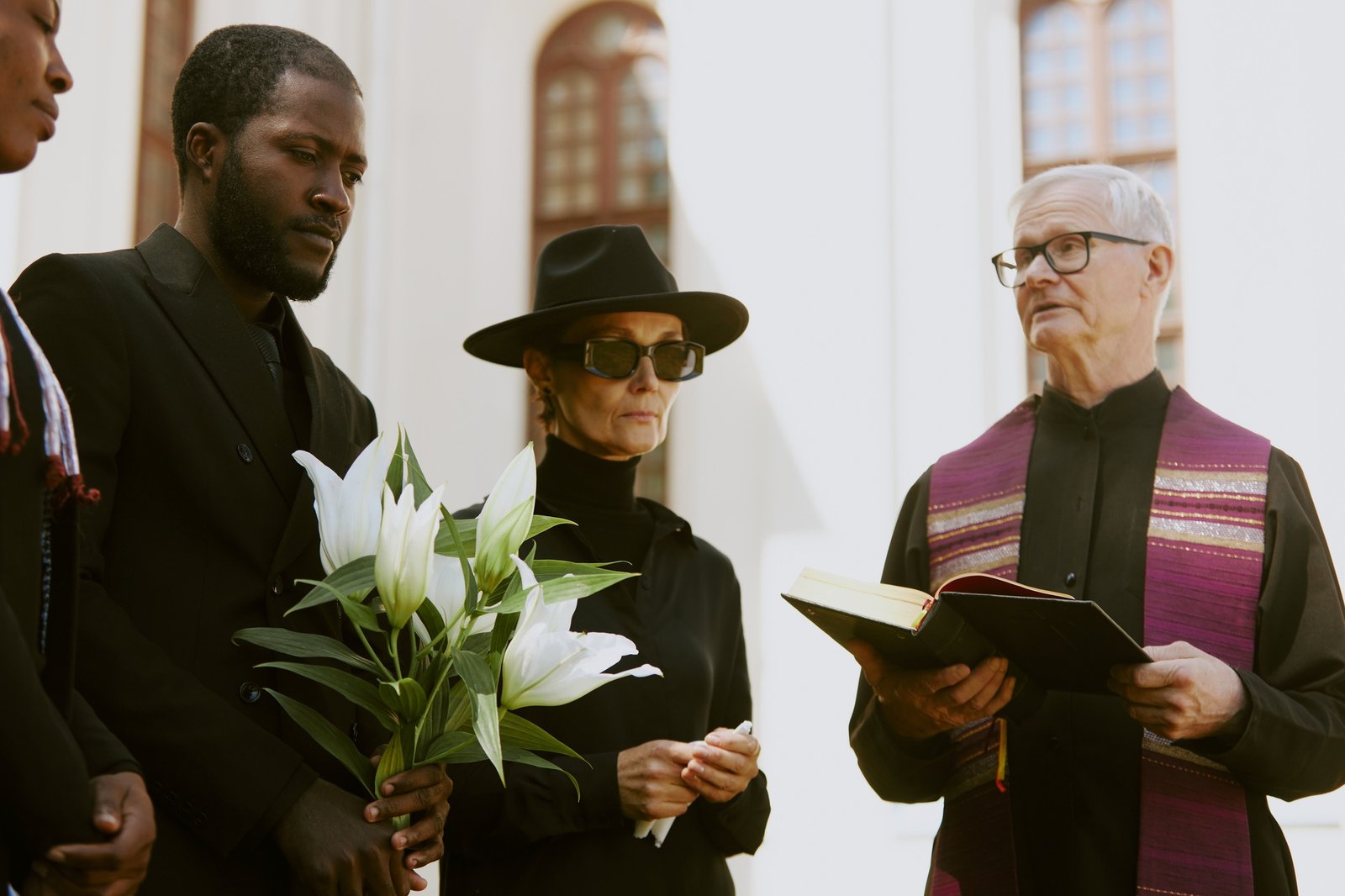 Priest Reading Prayer during Funeral